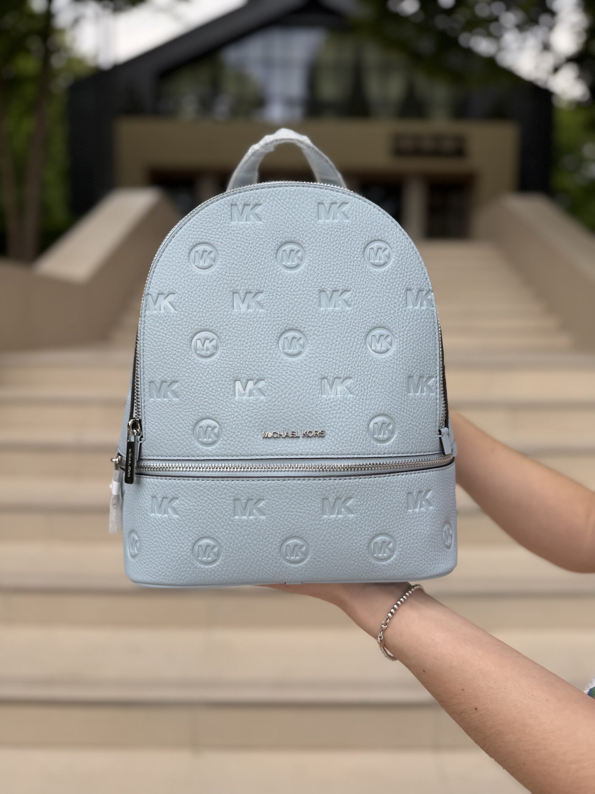 Rhea Medium Logo Debossed Backpack у кольорі Pale Ocean — жіночий рюкзак Michael Kors